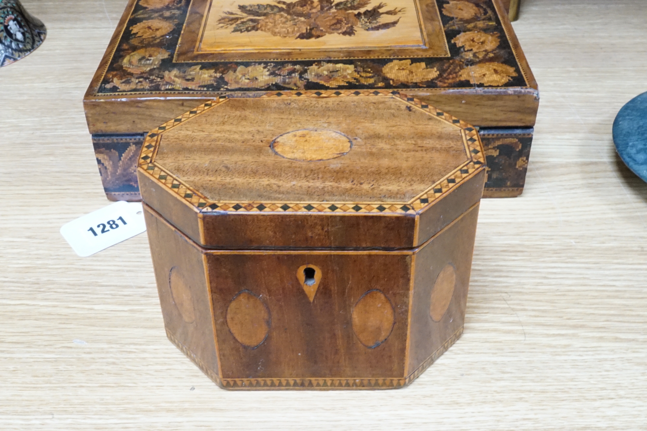 A walnu brass bound writing slope, an octagonal inlaid tea caddy and a Tunbridgeware box, 26cm wide, 22cm deep